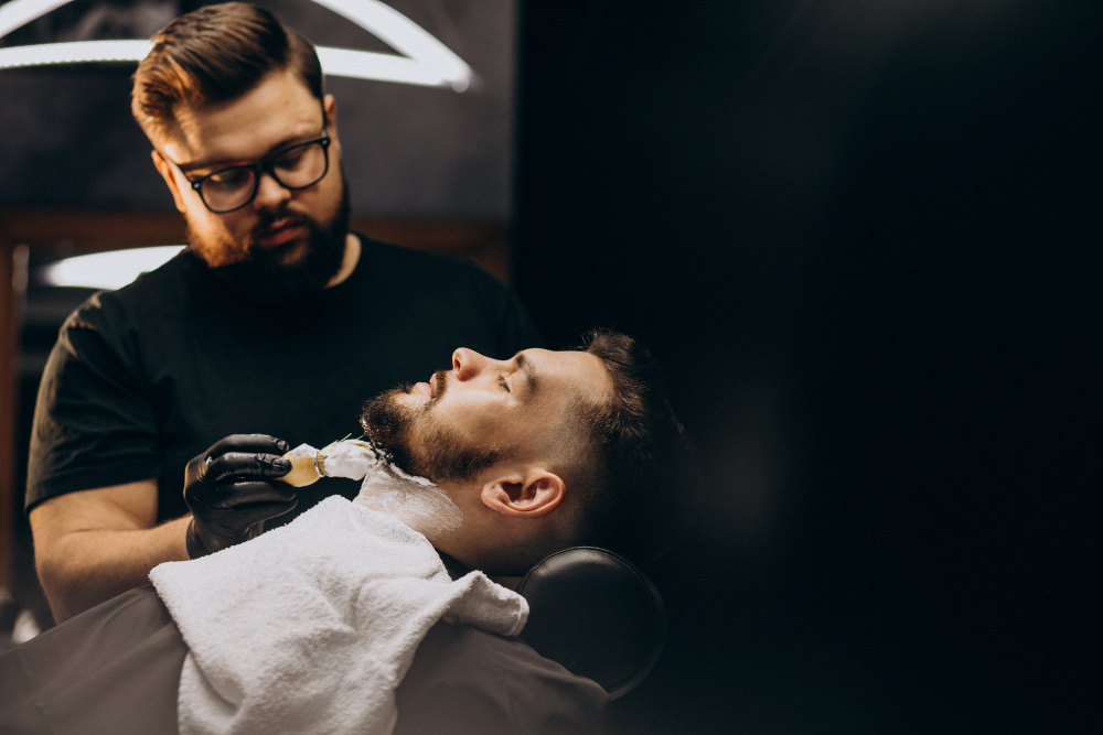 handsome man cutting beard at barber salon 1