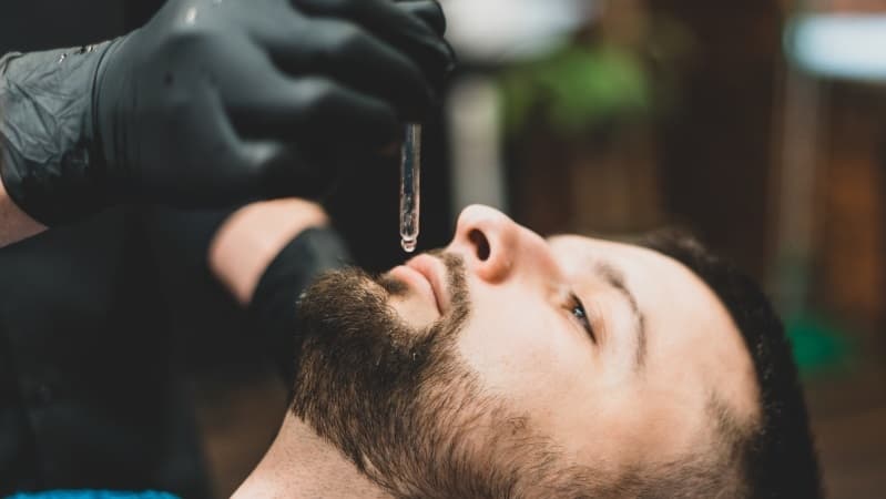 Beard oil care to prevent beard dandruff with Rebel Barbers
